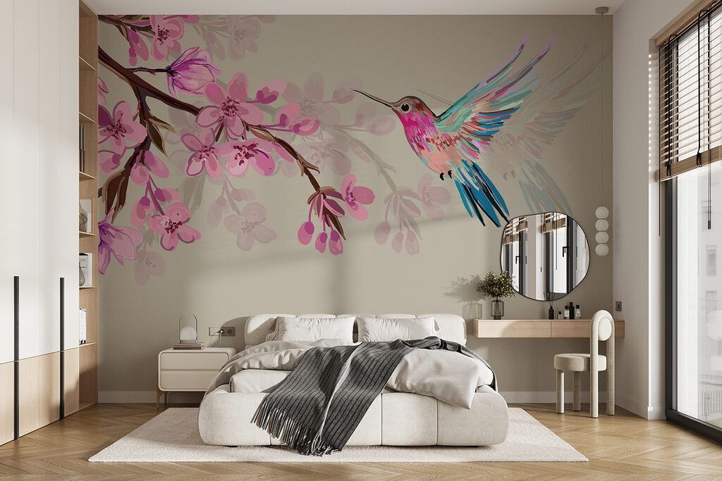Colibrí entre flores rosas en un interior